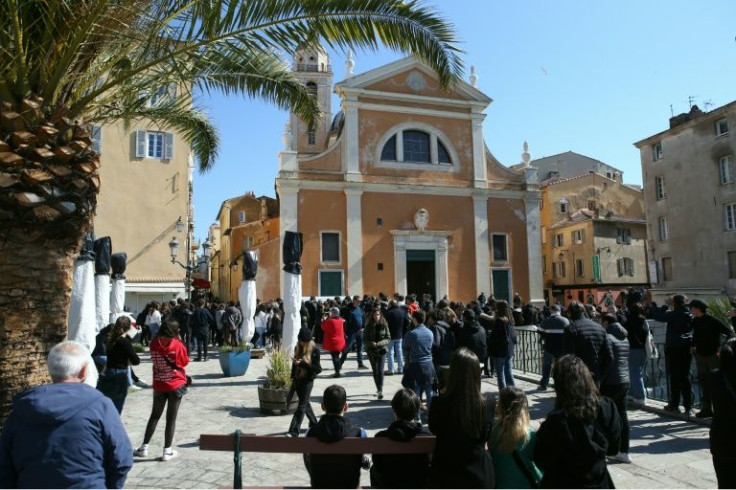 High school students gather outside Ajaccio's cathedral during a march in pay tribute to Colonna on Tuesday.