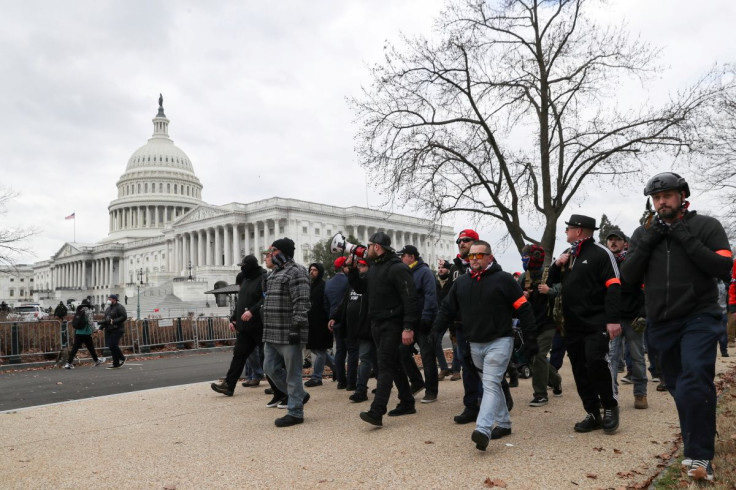 Members of the the far-right group Proud Boys march to the U.S. Capitol Building in Washington, U.S., January 6, 2021. 