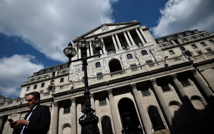 A man stands outside the Bank of England in the City of London, Britain April 19, 2017. Sterling basked in the glow of a six-month high following Tuesday's surprise news of a snap UK election. 