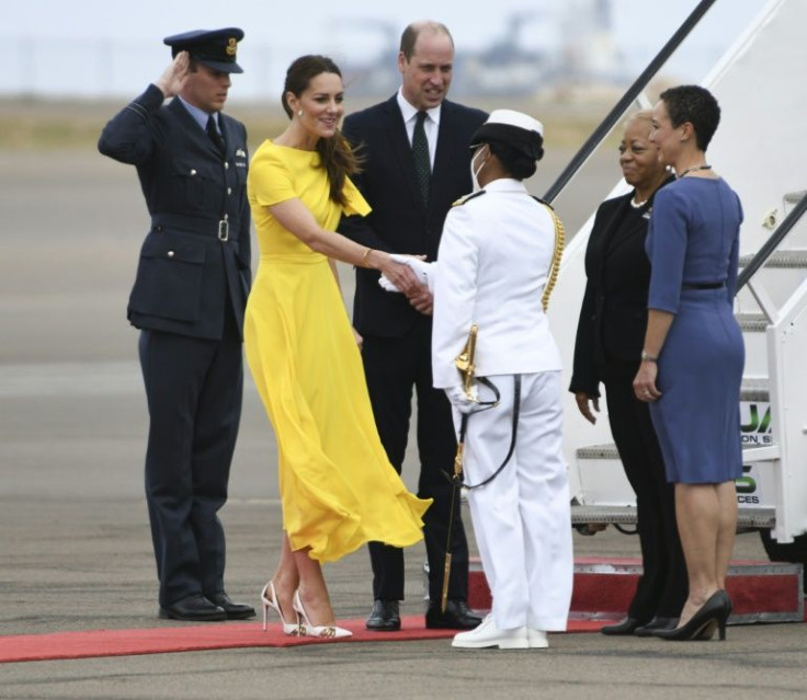 Prince William, Duke of Cambridge and his wife Catherine, Duchess of Cambridge are greeted by Jamaican goverment officials upon arrival in Kingston
