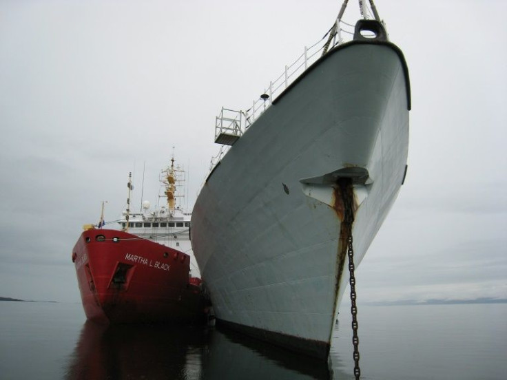 A Canadian coast guard vessel (L) refuels HMCS Fredericton (R) in Frobisher Bay during Canada's first and largest ever Arctic sovereignty exercise in August 2007