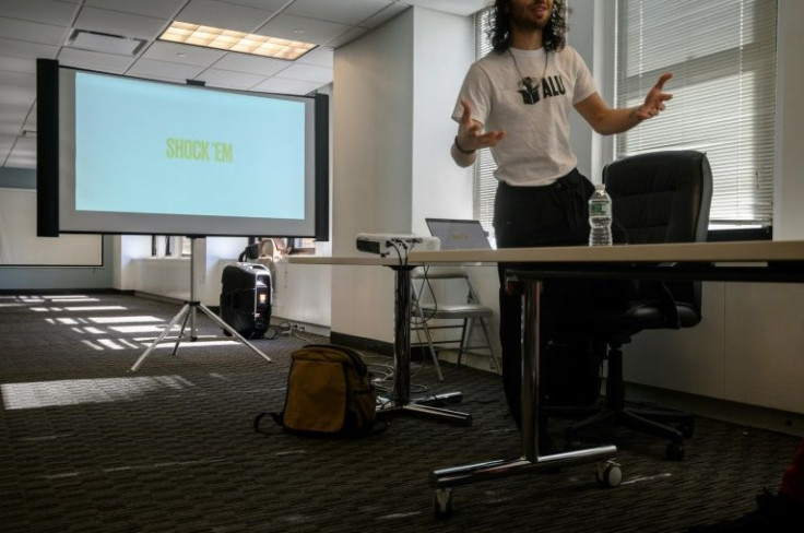 A speaker stands before a screen during an Amazon Labor Union 'phonebanking' event in New York city on March 11, 2022