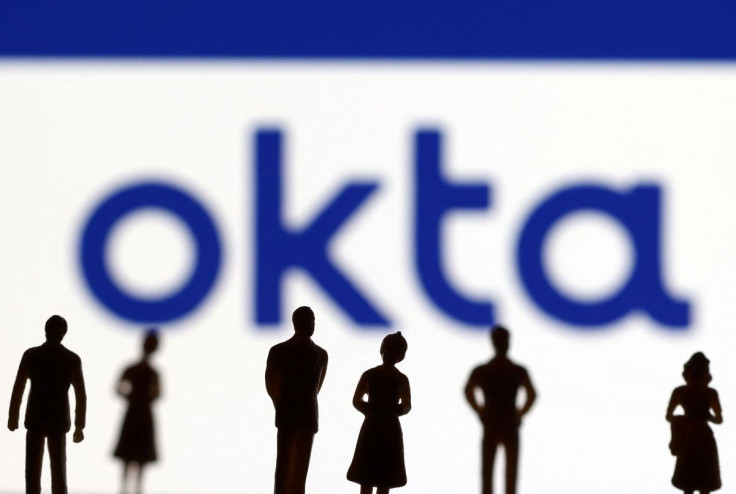 People's miniatures are seen in front of Okta logo in this illustration taken March 22, 2022. 