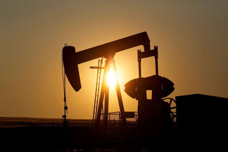 An oil pump jack pumps oil in a field near Calgary, Alberta, Canada on July 21, 2014.  