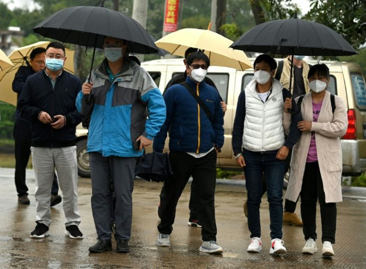 Relatives of passengers arrive at the entrance to the crash site