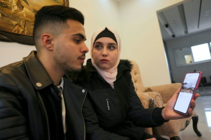 Ukrainian Viktoria Saidam and her Palestinian husband Ibrahim Saidam at their family home in the refugee camp of Bureij in the central Gaza Strip on March 22, 2022