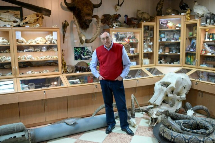 Director Volodymyr Topchyi poses with an exploded Russian rocket that landed on the zoo's territory