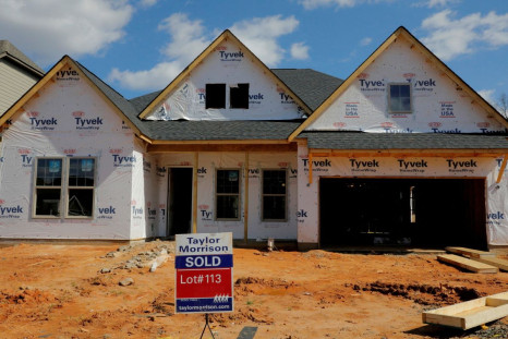 A home under construction stands behind a "sold" sign in a new development in York County, South Carolina, U.S., February 29, 2020. 