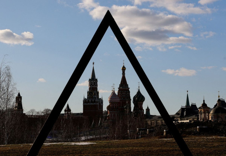 The Kremlin's Spasskaya Tower and St. Basil's Cathedral are seen through an art object in Zaryadye park in Moscow, Russia March 15, 2022.  