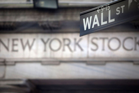 A Wall Street sign is pictured outside the New York Stock Exchange in New York, October 28, 2013.  