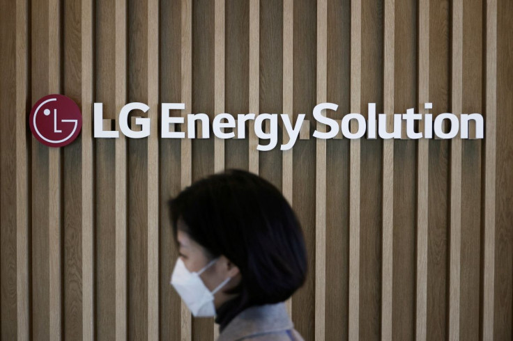 An employee walks past the logo of LG Energy Solution at its office building in Seoul, South Korea, November 23, 2021.  