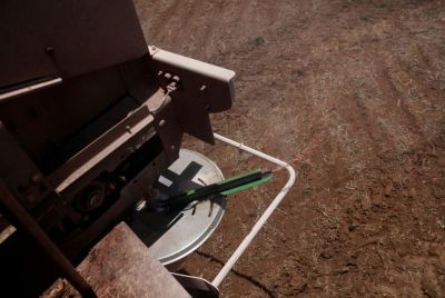 Fertilizer is seen in a tractor as it is being spread in a soybean field, near Brasilia, Brazil February 15, 2022. Picture taken February 15, 2022.