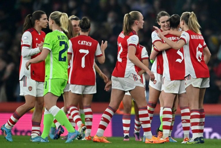 Late show: Arsenal's English defender Lotte Wubben-Moy (2nd right) is congratulated on her equaliser