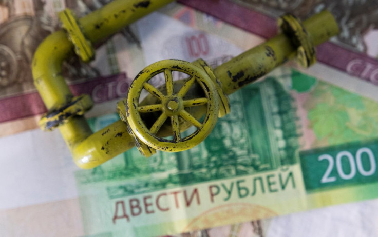 A model of the natural gas pipeline is placed on Russian Rouble banknotes in this illustration taken, March 23, 2022.