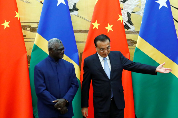 Solomon Islands Prime Minister Manasseh Sogavare and Chinese Premier Li Keqiang attend a signing ceremony at the Great Hall of the People in Beijing, China October 9, 2019.  