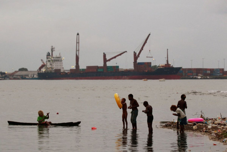 Children fish at a beach in central Honiara, the capital of the Solomon Islands, on September 14, 2012..