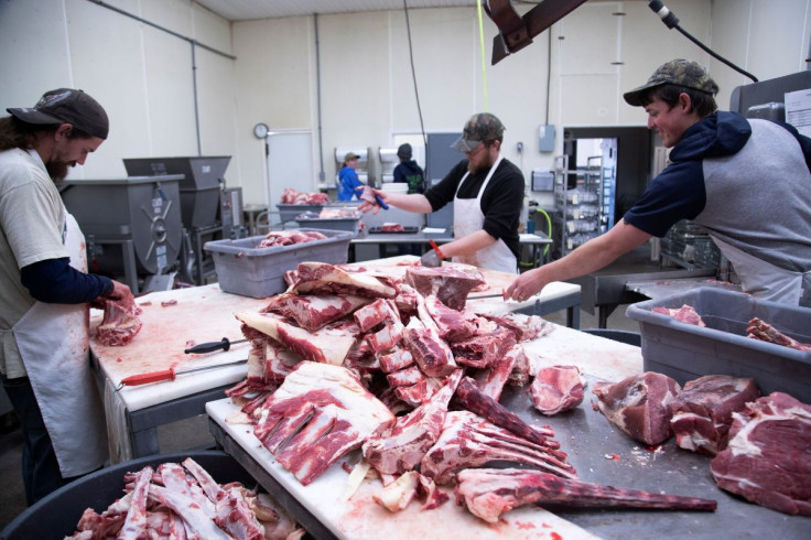 Employees cut fresh beef meat into small pieces at the First Capitol Meat Processing plant amid shortages of animal products due to supply chain issues created by the coronavirus disease (COVID-19) pandemic in Corydon, Indiana U.S. January 31, 2022.