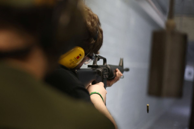A man shoots at a target with a rifle during practice session at a shooting range in Warsaw, Poland March 23, 2022.