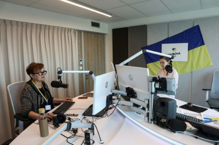 Lyudmila Wannek (L) and Sofia Tatomyr work with "Radio Ukrajina", which broadcasts news, tips for Ukrainian refugees, music and fairy tales for children, as well as spiritual comfort passed on by Ukrainian churches