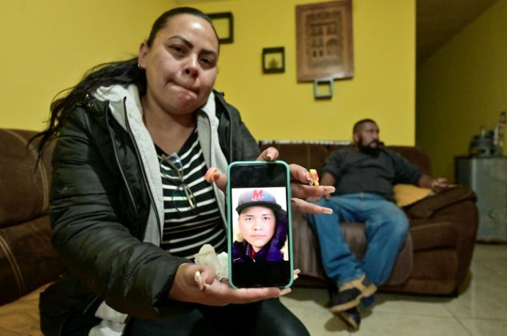 Nancy Reyes shows a photo of her son Jorge Luis Robles -- one of more than 95,000 people missing in Mexico