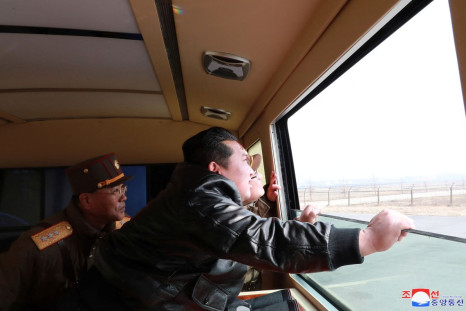 North Korean leader Kim Jong Un looks through a window during the test firing of what state media report is a "new type" of intercontinental ballistic missile (ICBM) in this undated photo released on March 24, 2022 by North Korea's Korean Central News Age