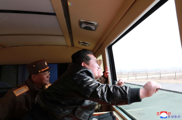 North Korean leader Kim Jong Un looks through a window during the test firing of what state media report is a "new type" of intercontinental ballistic missile (ICBM) in this undated photo released on March 24, 2022 by North Korea's Korean Central News Age