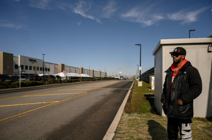 Amazon union leader Christian Smalls waits as workers cast their vote over whether or not to unionize, outside an Amazon warehouse in Staten Island on March 25, 2022