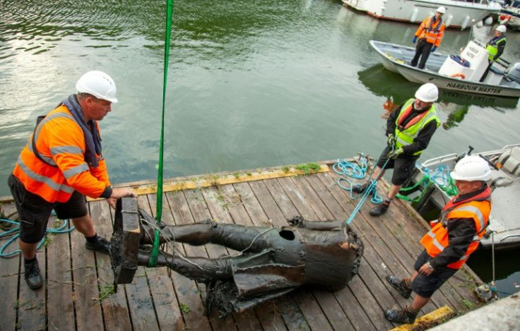 Anti-racism protesters toppled the statue of a 17th century slave trader and threw it in Bristol harbour, as part of anger at Britain's colonial past