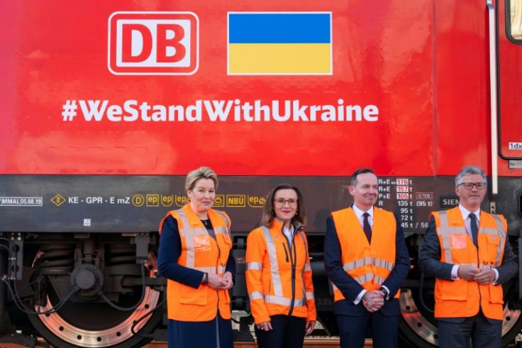 (L-R) Berlin's mayor Franziska Giffey, DB Cargo CEO Sigrid Nikutta, German Minister for Transport and Digital Affairs Volker Wissing and Ukraine's ambassador to Germany Andrij Melnyk pose in front of the engine