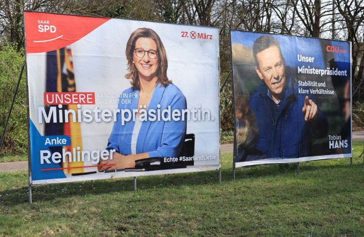Election posters of Anke Rehlinger (L), top candidate for the Social Democratic party SPD and Tobias Hans, top candidate for the Christian Democratic Union party CDU for the upcoming March 27, 2022, election in Germany's smallest federal state of the Saar