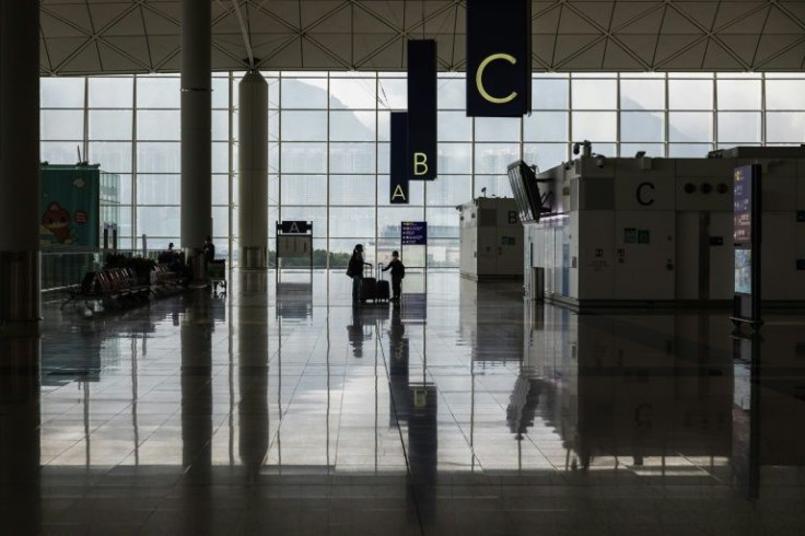 Passengers arrive at the international airport in Hong Kong