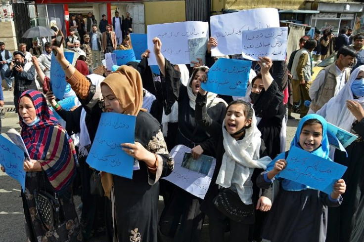 Afghan women and girls take part in a protest in front of the Ministry of Education in Kabul