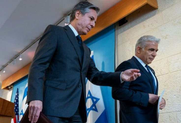 US Secretary of State Antony Blinken, left, walks with Israel's Foreign Minister Yair Lapid, following a joint press conference in Jerusalem, on March 27, 2022