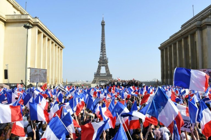 Far-right candidate Eric Zemmour rallied thousands of supporters near the Eiffel Tower on Sunday