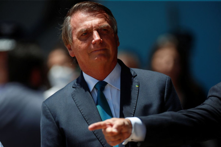 Brazil's President Jair Bolsonaro looks on during a welcome ceremony to receive the Brazilians and foreigners evacuated from Ukraine during the mission of repatriation, at the Brasilia Air Base, in Brasilia, Brazil March 10, 2022.