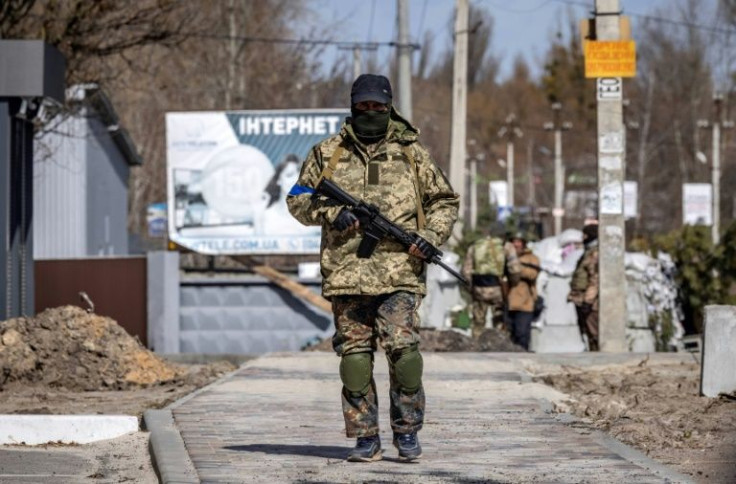 At a sandbagged checkpoint, one militia member said it was 'suicidal' to try to cross into the main part of the village