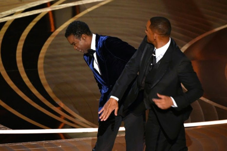 US actor Will Smith slaps US actor Chris Rock onstage during the 94th Oscars