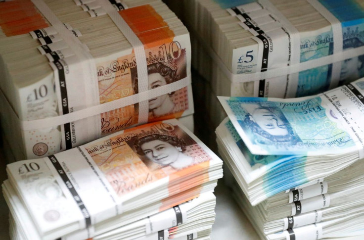 Wads of British Pound Sterling banknotes are stacked in piles at the Money Service Austria company's headquarters in Vienna, Austria, November 16, 2017. 