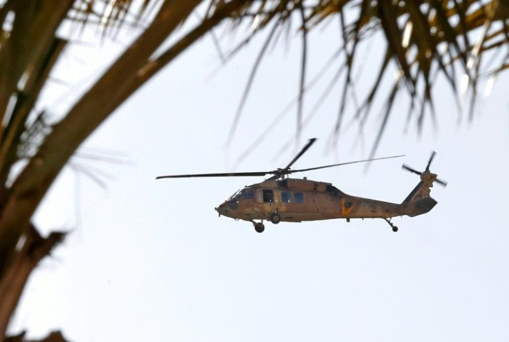 An Israeli military helicopter flies over Sde Boker ahead of the Negev Summit