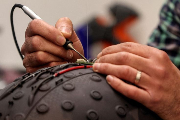 A worker at the Israeli startup Brain.Space builds an electroencephalogram (EEG) enabled helmet, due to be used in an experiment on the impact of a microgravity environment on the brain activity of astronauts, in Tel Aviv, Israel, March 23, 2022. Picture 