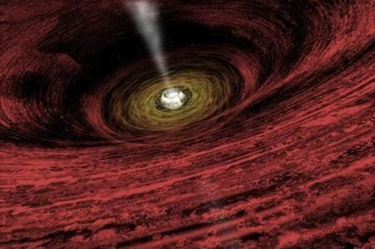 An artist&#039;s impression of a growing supermassive black hole located in the early Universe is seen in this NASA handout illustration released on June 15, 2011.