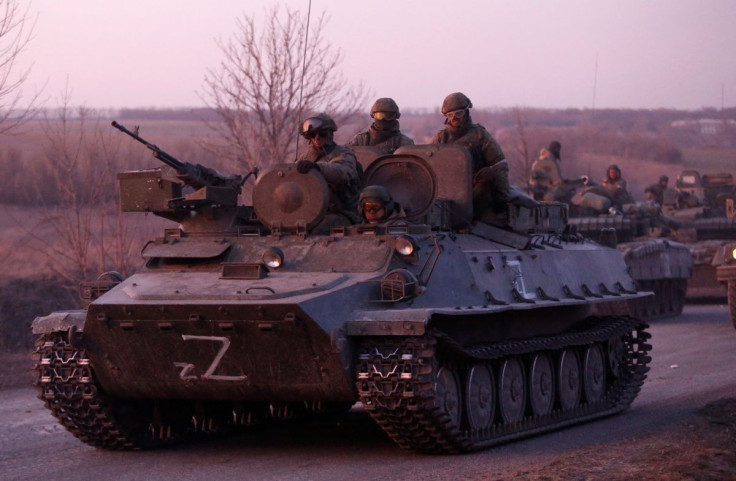 A view shows an armoured convoy of pro-Russian troops in the course of Ukraine-Russia conflict on a road leading to the besieged southern port city of Mariupol, Ukraine March 28, 2022. 