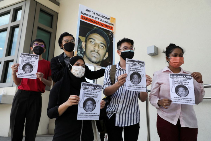 Activists hold posters against the execution of Nagaenthran Dharmalingam as activists submit a clemency petition at the Singapore High Commission in Kuala Lumpur, Malaysia, March 9, 2022.