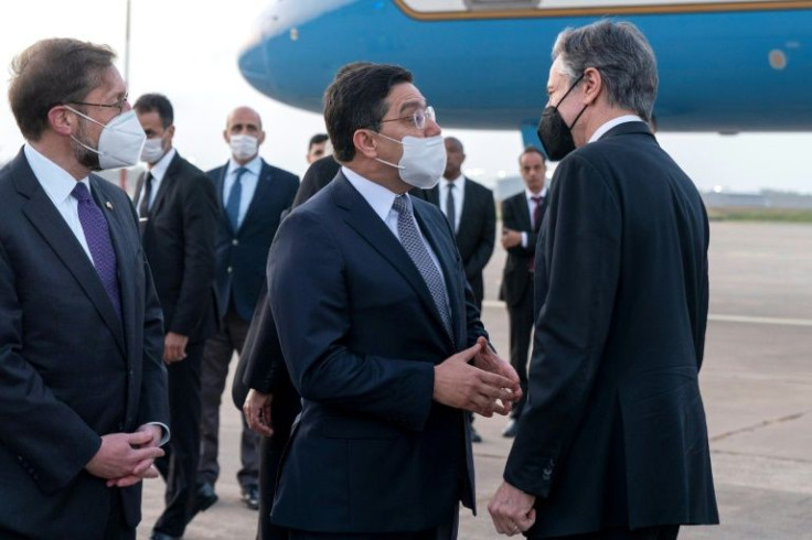 US Secretary of State Antony Blinken is greeted by Morocco's Foreign Minister Nasser Bourita on arrival to Rabat, on March 28, 2022