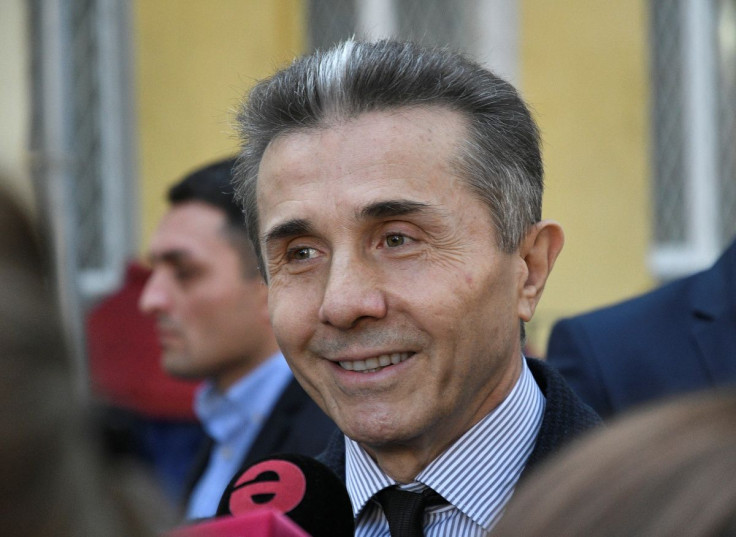 Georgia's former Prime Minister Bidzina Ivanishvili addresses the media as he visits a polling station during the presidential election in Tbilisi, Georgia November 28, 2018.