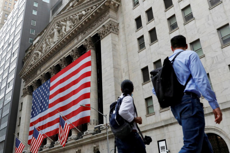 People walk by the New York Stock Exchange (NYSE) in Manhattan, New York City, U.S., August 9, 2021.