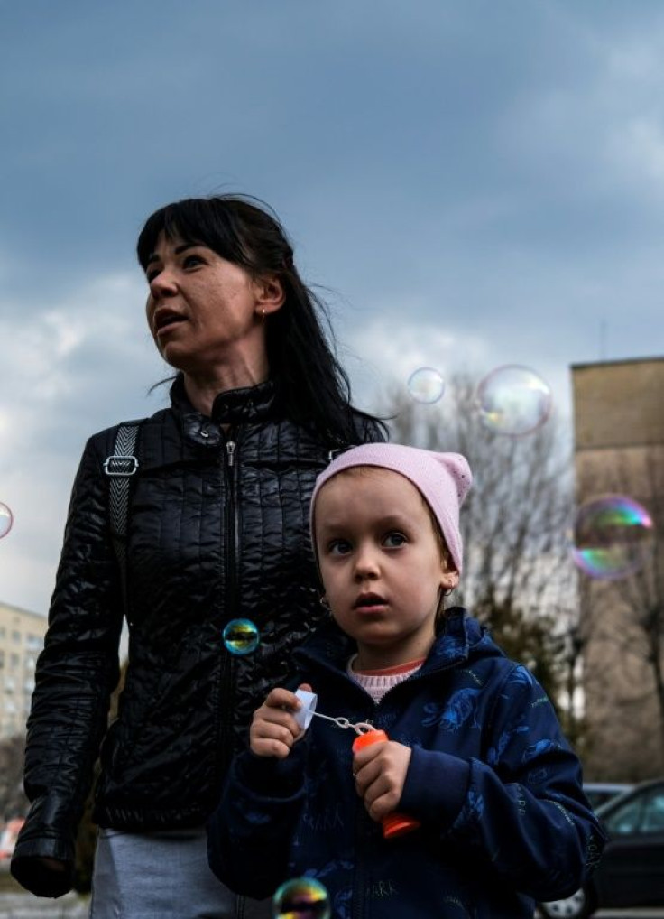 A displaced woman and her daughter from the village of Rudnytske arrive in Brovary, north of the Ukrainian capital of Kyiv