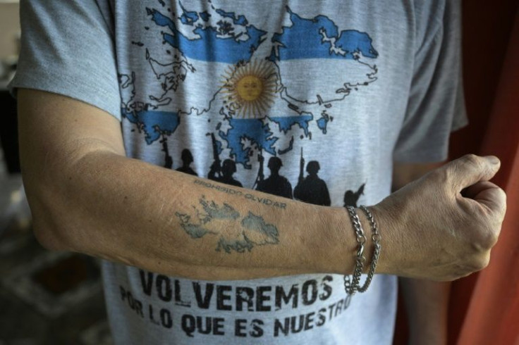 An Argentine Falklands war veteran displays his tattooed arm depicting the Malvinas (Falklands) islands reading "Forbidden to forget" in Buenos Aires, Argentina on March 7, 2022