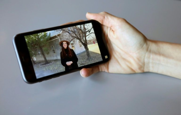 Mennonite influencer Marcela Enns shows a video on her cellphone in Ciudad Cuauhtemoc in northern Mexico