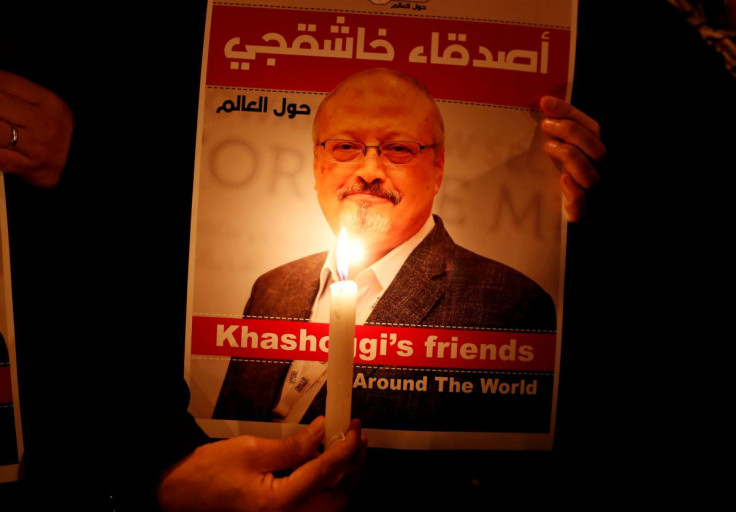 A demonstrator holds a poster with a picture of Saudi journalist Jamal Khashoggi outside the Saudi Arabia consulate in Istanbul, Turkey October 25, 2018.